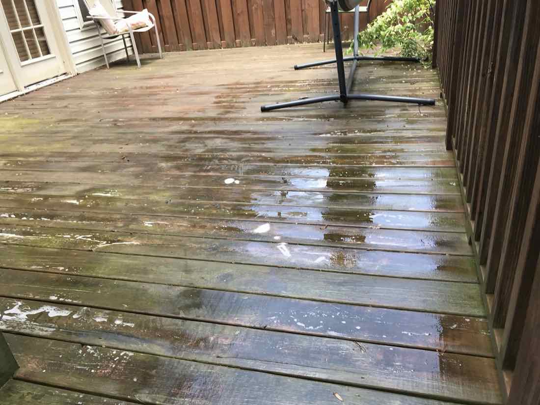 Gray, weathered wood deck before cleaning